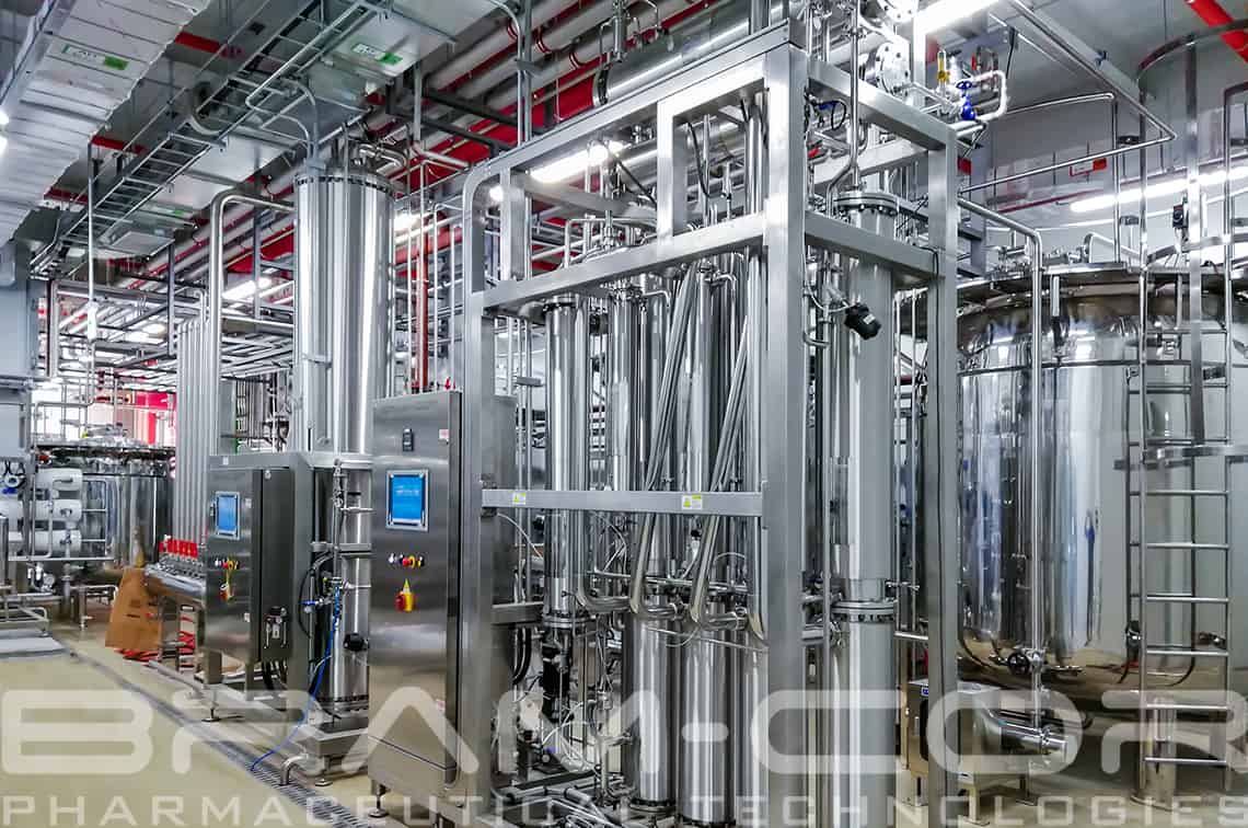 A classic Bram-Cor Multiple Effect Distiller working in a biopharma water treatment room